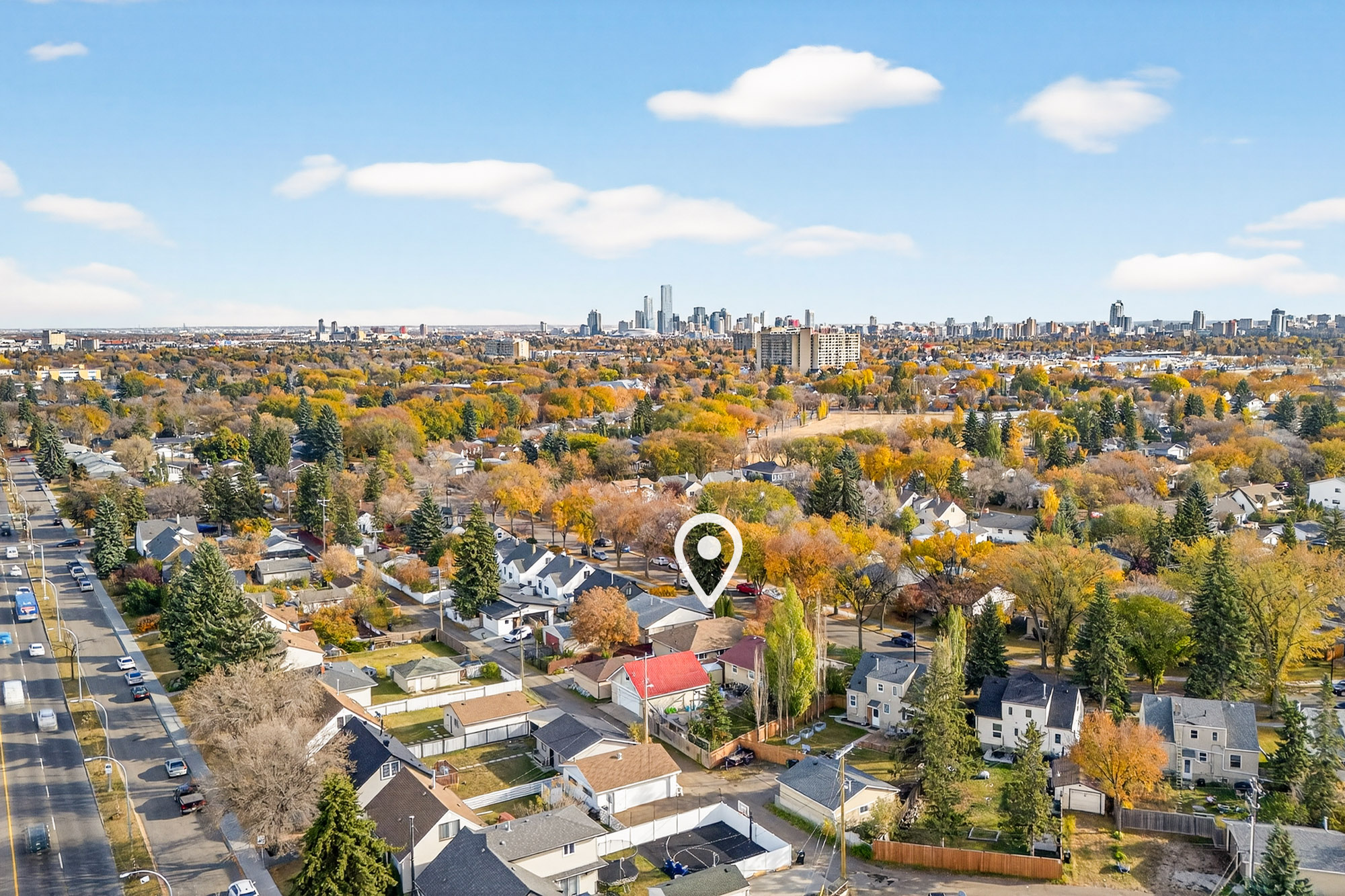 Upgraded 5-bedroom bungalow for sale in Woodcroft Edmonton on a tree-lined street with mature landscaping.